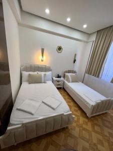 Postel nebo postele na pokoji v ubytování LUXIN