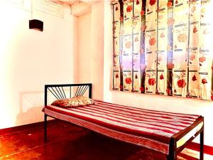 Postel nebo postele na pokoji v ubytování Coca Cola Hostel Malabe