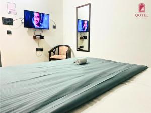 Postel nebo postele na pokoji v ubytování Qotel Hotel Rama Rohini Sector-24 Couple Friendly