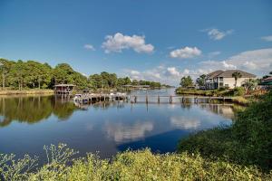 a view of a river with houses and a dock at The Inn at St Thomas Square 1203C in Panama City Beach