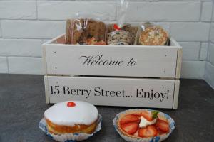 a box of donuts and a box of muffins at 3 Bedroom Cottage in Conwy with Parking Sleeps 4 in Conwy