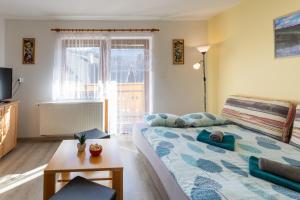 TV a/nebo společenská místnost v ubytování Apartmaji Matej Cvetek
