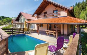 a house with a swimming pool and some chairs at Guest house Donna in Vrata