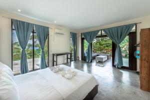 Postel nebo postele na pokoji v ubytování Ohana Resort Siargao
