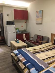 Kuchyň nebo kuchyňský kout v ubytování 果芒驛站旅店