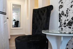 TV a/nebo společenská místnost v ubytování Rein Klassik Hotel