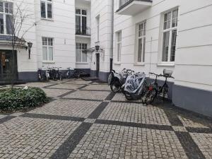 a group of bikes parked next to a building at Fantastic Apartments - OK11 Room - C in Warsaw