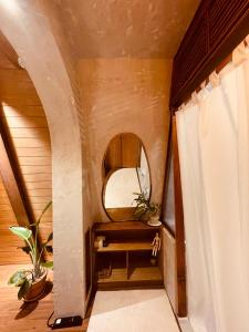 a small room with a mirror and a window at Dongbok Sanjang Jeju in Jeju