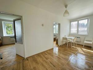 an empty living room with a table and chairs at Apartmán pod Boubínem in Horní Vltavice