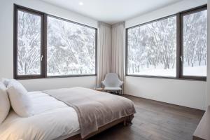 Ένα ή περισσότερα κρεβάτια σε δωμάτιο στο Song Saa Chalet