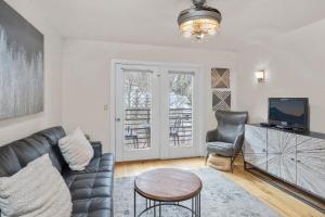 a living room with a couch and a table at River Location 2 blocks to lift 7 &to the Gondola in Telluride