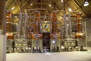 a brewery with a clock on the front of it at Gîte Le Sambre in Thuin