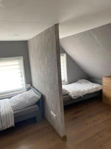 Ένα ή περισσότερα κρεβάτια σε δωμάτιο στο Koog Rooms