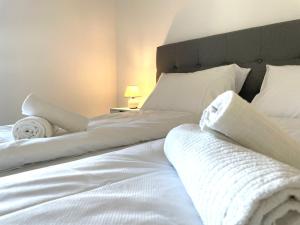 Letto o letti in una camera di homy City Lodge in Feldkirch, Grenznähe und doch Zentral