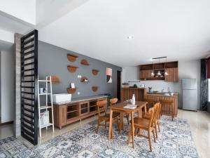 a kitchen and dining room with a table and chairs at Cove Accordia Residence in Jakarta