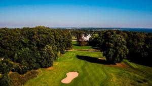 an overhead view of a golf course with a green at Mikkelborg B&B in Hørsholm