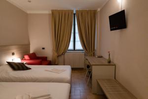 Postel nebo postele na pokoji v ubytování Villa Lomellini