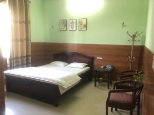 A bed or beds in a room at MÂY HOSTEL