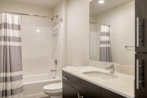 a white bathroom with a sink and a toilet at Bellevue 2br w yoga studio nr restaurants SEA-628 in Redmond +28 photos