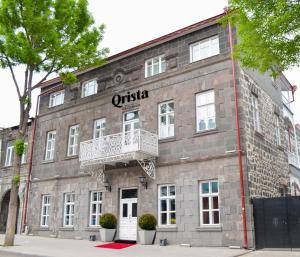 an office building with a balcony on the side of it at Qrista Managed by Dedeman in Kars