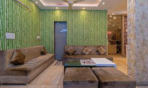 a living room with a couch and a table at Itsy By Treebo - P Grand in Ludhiana