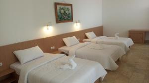 Postel nebo postele na pokoji v ubytování Guest House Simalem