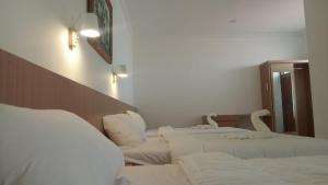Postel nebo postele na pokoji v ubytování Guest House Simalem