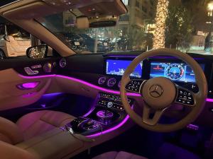 a view of the inside of acedes benz car with purple lighting at JAPAVISTA Casa De Boss in Naha