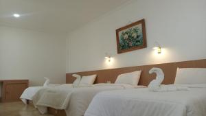 Postel nebo postele na pokoji v ubytování Guest House Simalem
