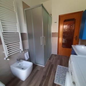 a bathroom with a sink and a toilet and a shower at Casa Val Mezzano in Ferrara