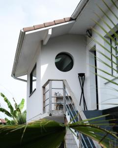 a house with a staircase leading up to it at Villa Sayulita Surfhouse in Seignosse