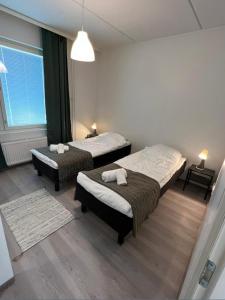 Postel nebo postele na pokoji v ubytování Kotimaailma - Kaunis 3MH asunto Pohjois-Haagassa