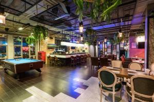 a restaurant with a pool table and a bar at T Pattaya Hotel by PCL in Pattaya Central