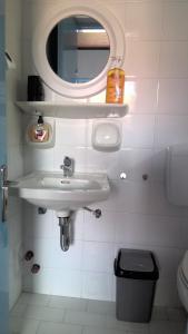 a bathroom with a sink and a mirror at Villa Antoinette in Mithymna