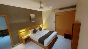 Hotel Suba Elite Vadodara客房内的一张或多张床位