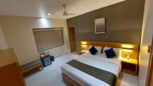 Hotel Suba Elite Vadodara客房内的一张或多张床位
