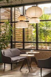 a living room with a couch and a table at Sir Anthony in Playa de las Americas
