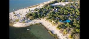 an aerial view of an island in the ocean at Shongili Island Lodge in Vila Praia Do Bilene