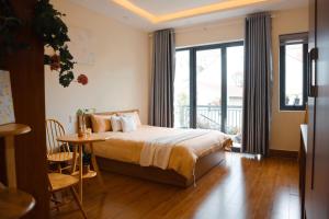 Postel nebo postele na pokoji v ubytování Anita homestay Dalat