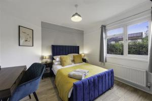 Llit o llits en una habitació de Beautiful 3 bedroom Home in Cambridgeshire