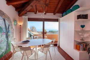 a dining room with a table and chairs at Villa Briziola in San Teodoro