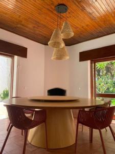 a dining room with a table and two chairs at Casa Calma in Albufeira