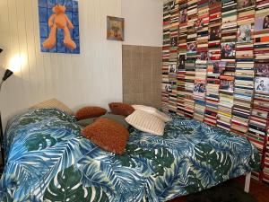a bed in a room with a book shelf at Book house 