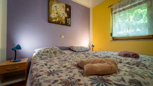 Ein Bett oder Betten in einem Zimmer der Unterkunft Guest house Donna