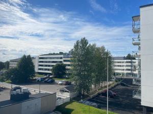 a view of a parking lot with a building at Rovakatu City apartment in Rovaniemi