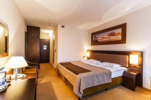 Postel nebo postele na pokoji v ubytování Hotel Solny + 37 fotografií