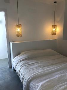 A bed or beds in a room at Casa Trece