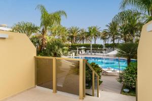 a view of the pool from the balcony of a resort at Sir Anthony in Playa de las Americas