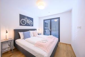 Postel nebo postele na pokoji v ubytování Cozy Ottakring