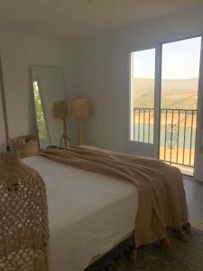 A bed or beds in a room at Casa Trece